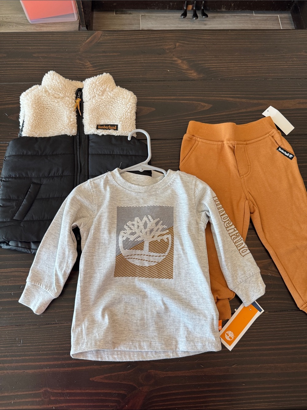 Timberland Kids Black & Cream Puffer Vest with Gray Logo Tee and Tan Joggers